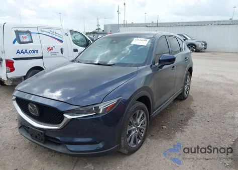 2021 Mazda Cx-5 Signature z USA, uszkodzony, nr VIN JM3KFBEY1M0343561